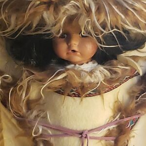 7" porcelain native American baby doll in a papoose